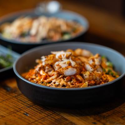 Asian bowl served on the table with other dishes in the background.