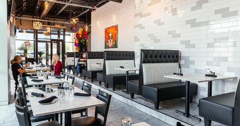 Interior, dining area with set tables and booths
