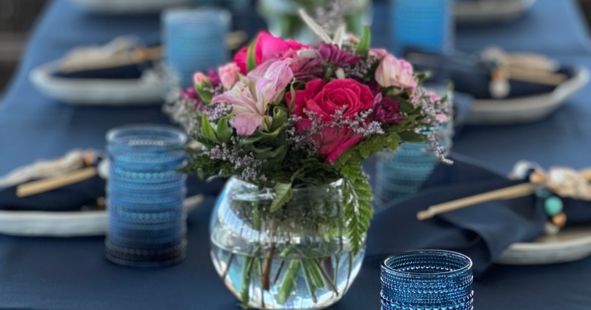 Glass bubble vase with roses