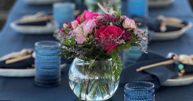 Glass bubble vase with roses