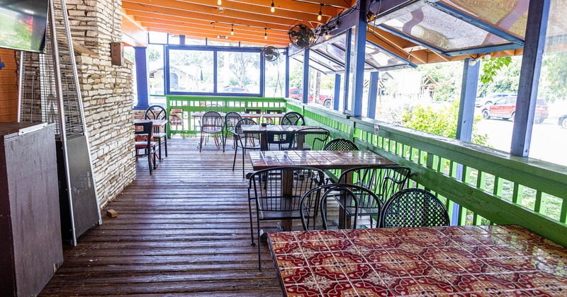 Exterior, tables and chairs on covered patio