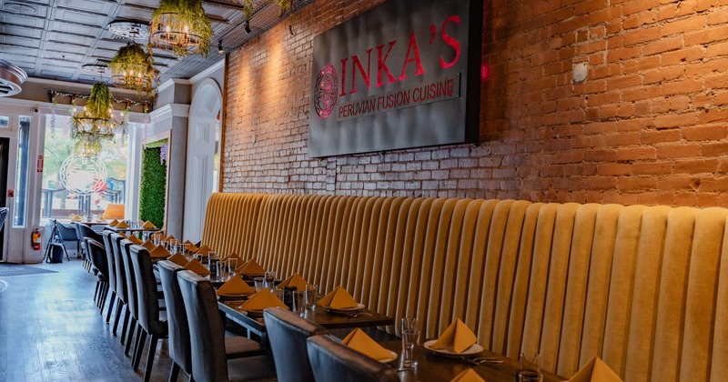 Interior of a restaurant with a mustard-yellow bench