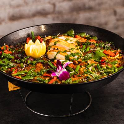 Paella Valenciana with chicken, Spanish chorizo, calamari and saffron broth.