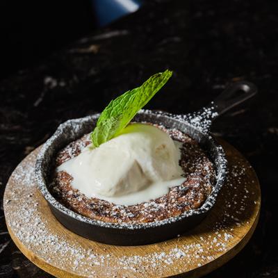Chocolate chip cookie, topped with ice cream