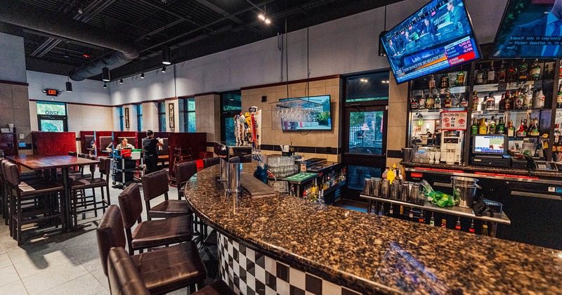 Bar area, bar stools and TV above the bar