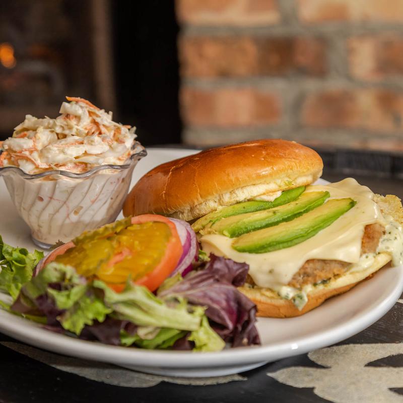 Turkey Burger with avocado, melted pepper jack cheese, lettuce, served with coleslaw