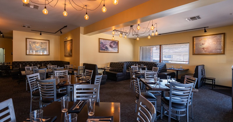 Restaurant interior, dining area with set tables