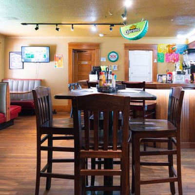 Interior, tall table and bar stools.