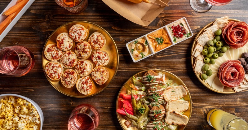 Assorted food plates and drinks, top down view