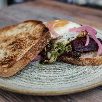 Toast with cashew butter, pumpkin chickpea spread and fried egg