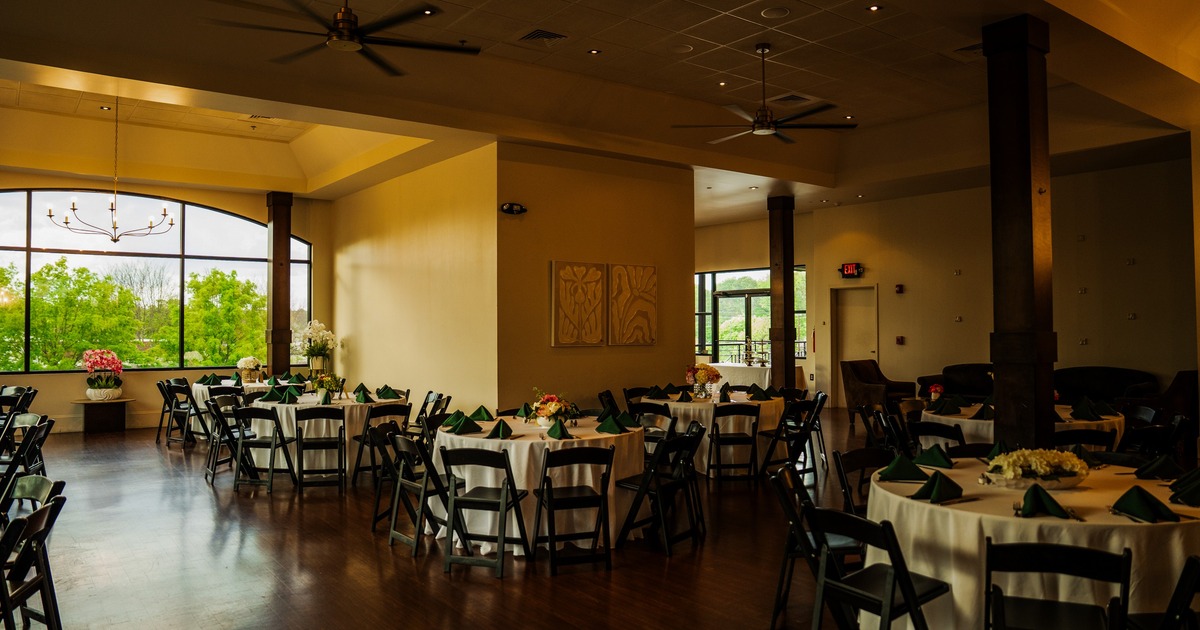 Interior, large dining area with large windows and fans on the ceiling