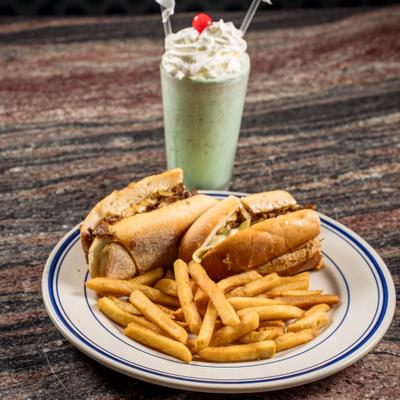 Philly cheesesteak, fries, and milkshake.