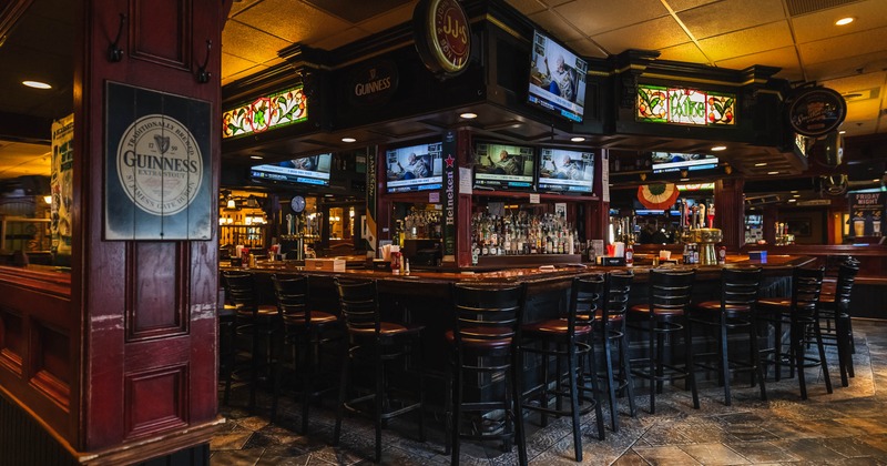 Cozy pub interior with a dark wood bar