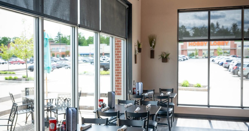Interior, tables and chairs near window