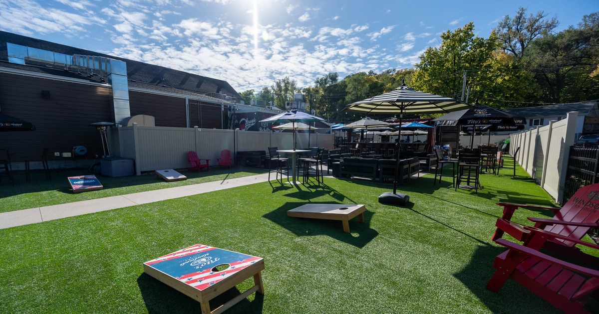 Exterior, lawn, partially covered seating and lounge area, outdoor games