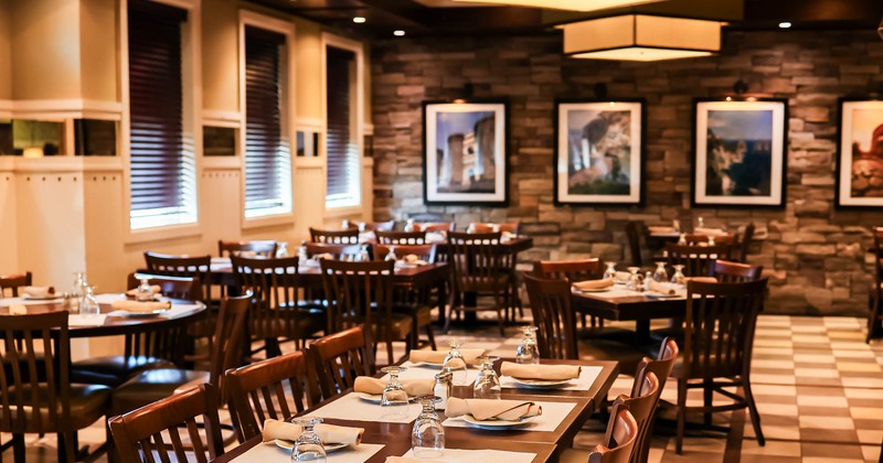Interior, set dining tables waiting for guests