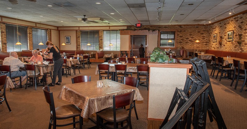 Interior, spacious dining area with tables and chairs