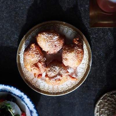 Fry bread dusted with powdered sugar.