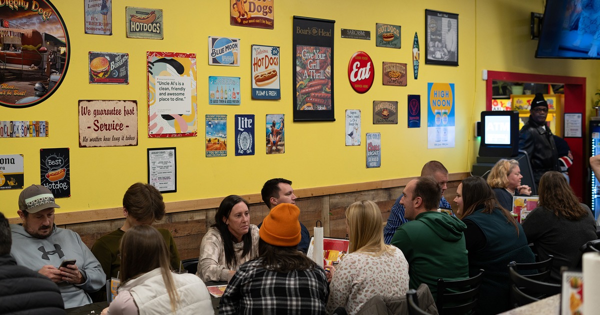 Interior, seating area, guests chatting and enjoying their drinks