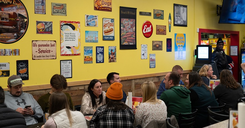 Interior, seating area, guests chatting and enjoying their drinks