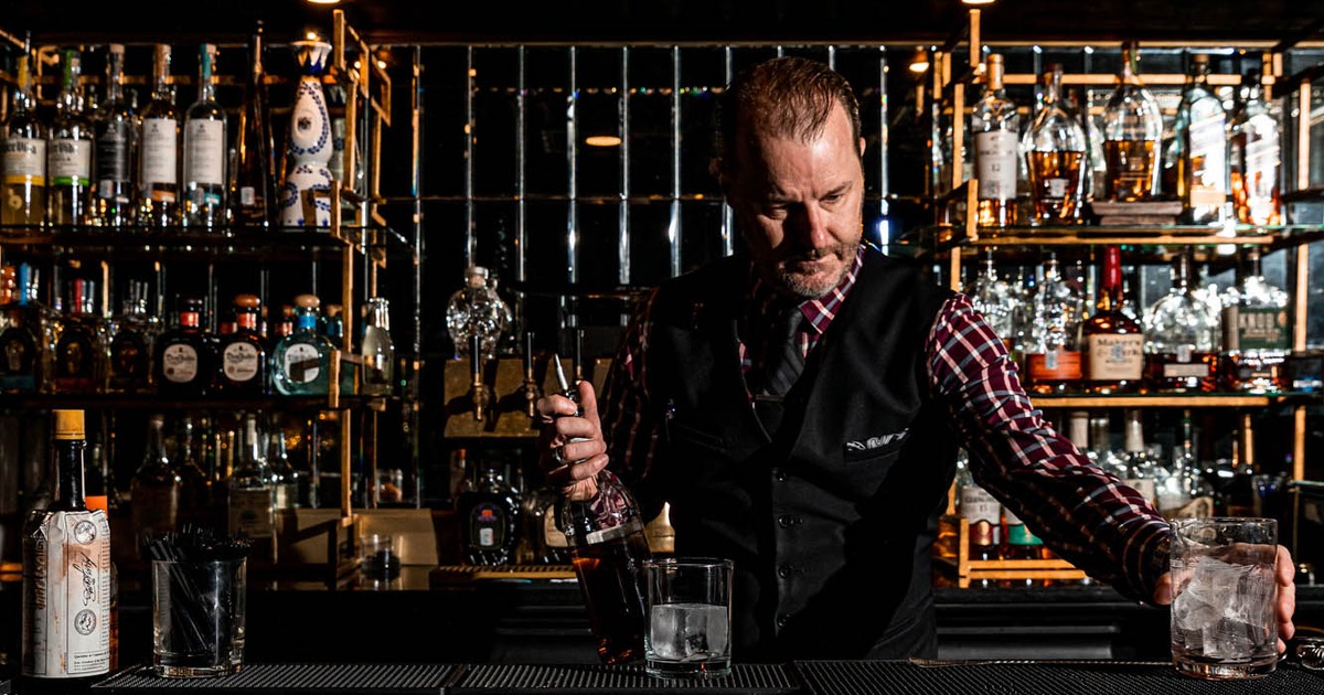 A bartender preparing a drink