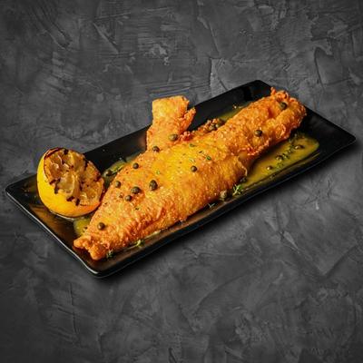 Fried fish with lemon and capers.