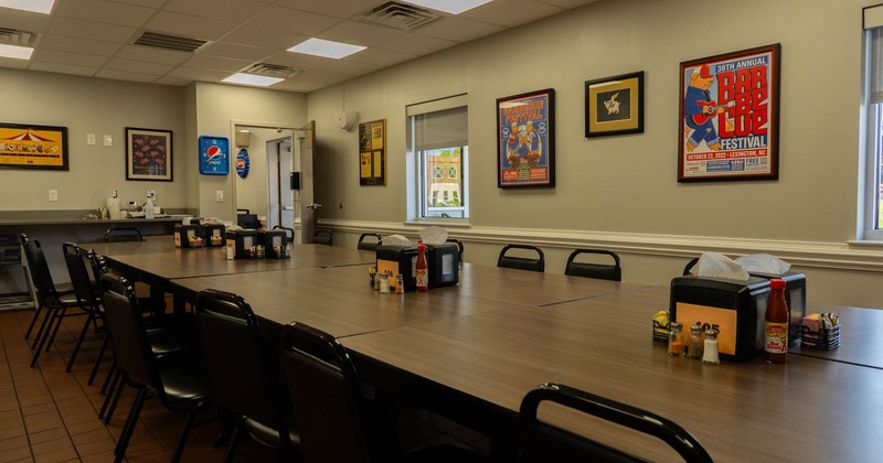 Interior seating area with a group table, vintage posters decor