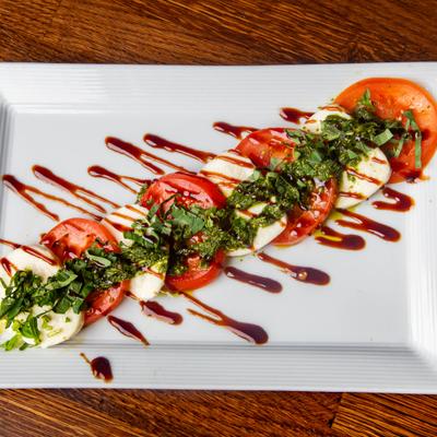 Caprese salad with balsamic drizzle.
