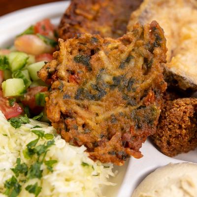 Mama's Mix with various ithems and latke in a foreground.