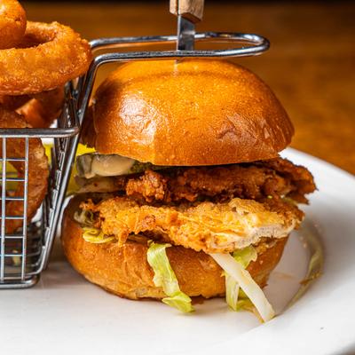 Fried chicken sandwich and onion rings.
