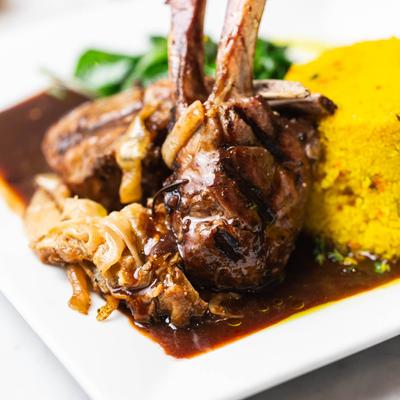 Rack of lamb with couscous and spinach.