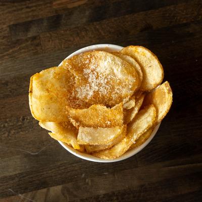 Small bowl of potato chips.