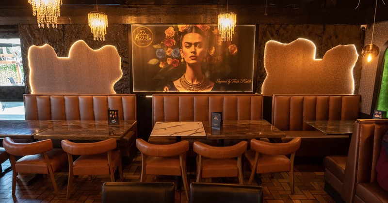 Interior, seating area with booths, tables and chairs