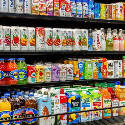 Selection of drinksa with a variety of bottled and caned beverages.