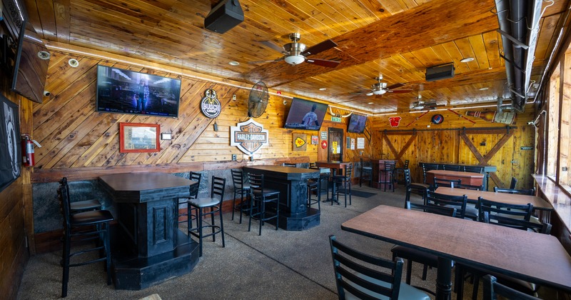 Bar tables, bar stools, screen above
