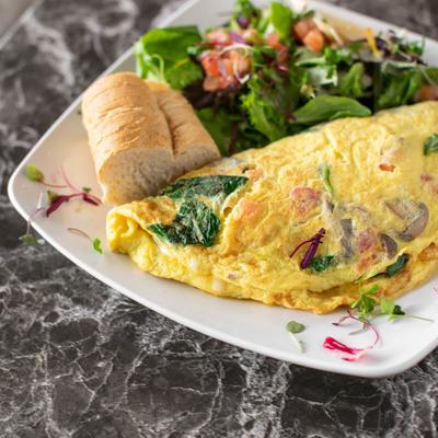 Spinach and mushroom omelette, served with salad