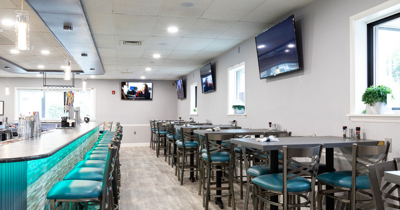 Interior, tables lined up and bar