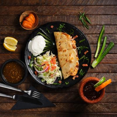 Quesadillas, served with shredded cabbage, pico, zucchini  and sour cream.
