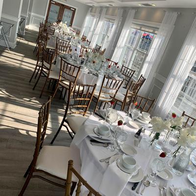 Table settings arranged in bright afternoon light.