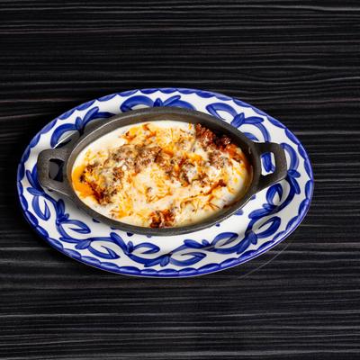 Melted cheese dip with Mexican sausage