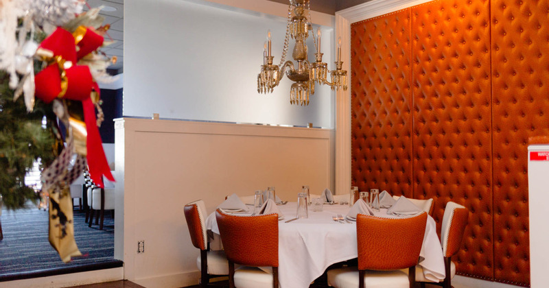 Interior, round tables set with tableware