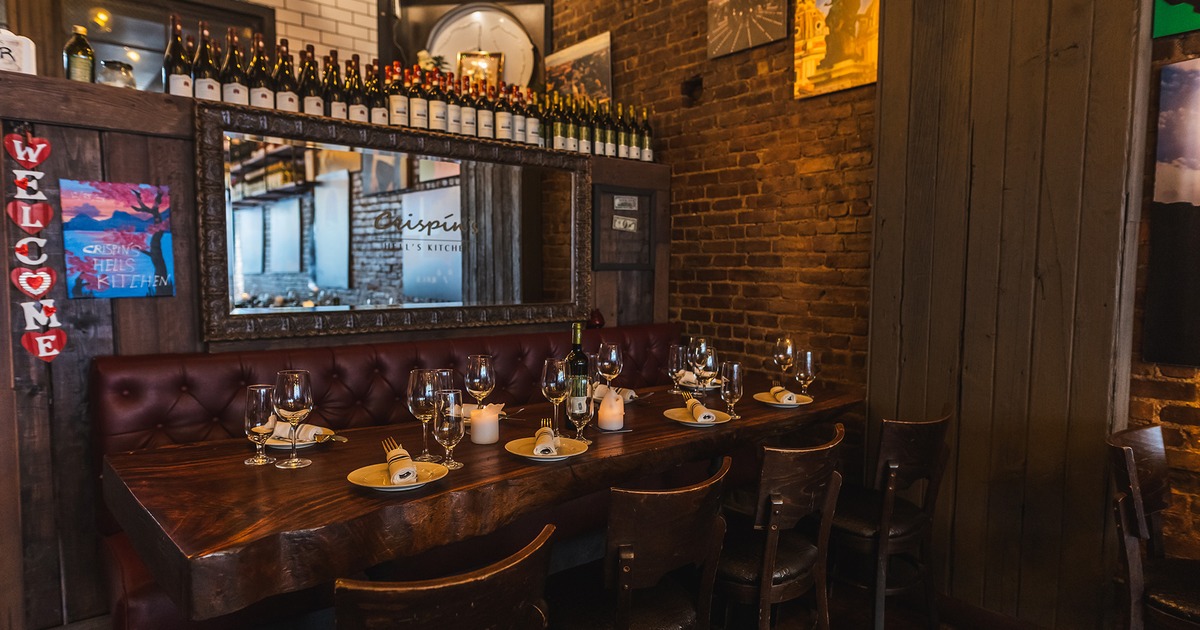 Restaurant interior, dining table in the corner set up for eight guests