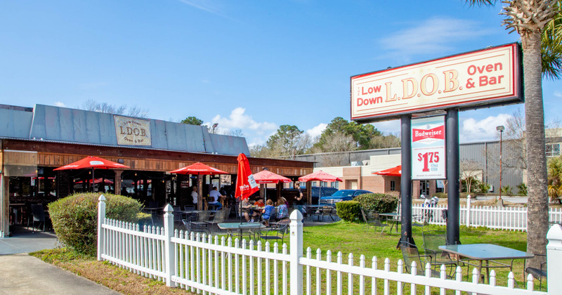 Exterior, wide view of the patio and the restaurant sign