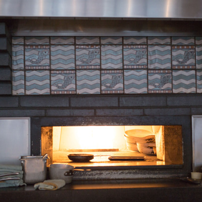View of the open oven in the front of the kitchen area