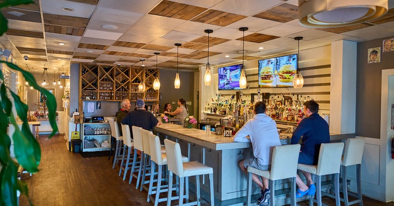 Customers sitting at the bar