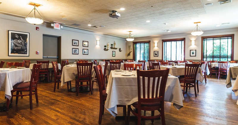 Restaurant interior, dining area with set tables