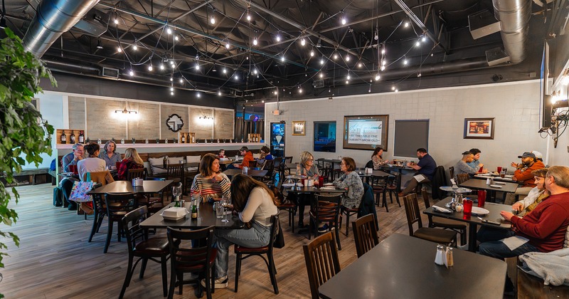 Interior, dining area full of guests enjoying their food
