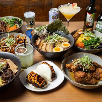 Variety of menu items served on the table alongside drinks.