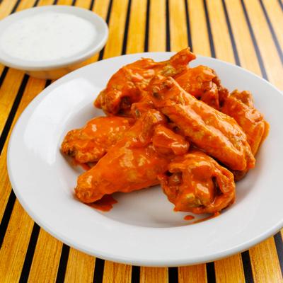 Hot Wings with ranch sauce on the side.