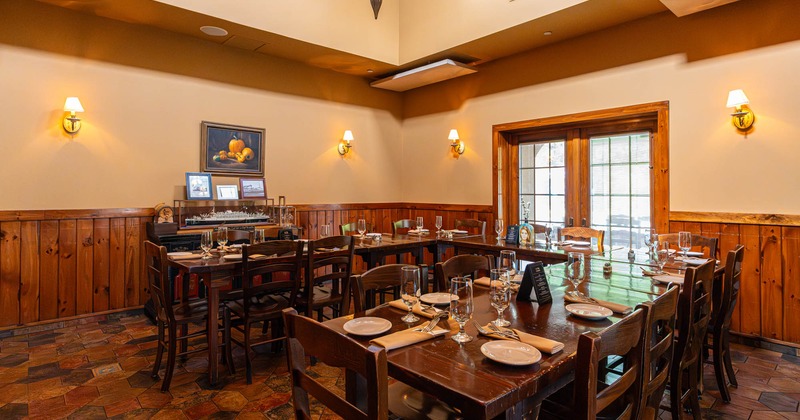 Interior, dining area, ''U'' shaped table setup, ready for guests, tile flooring